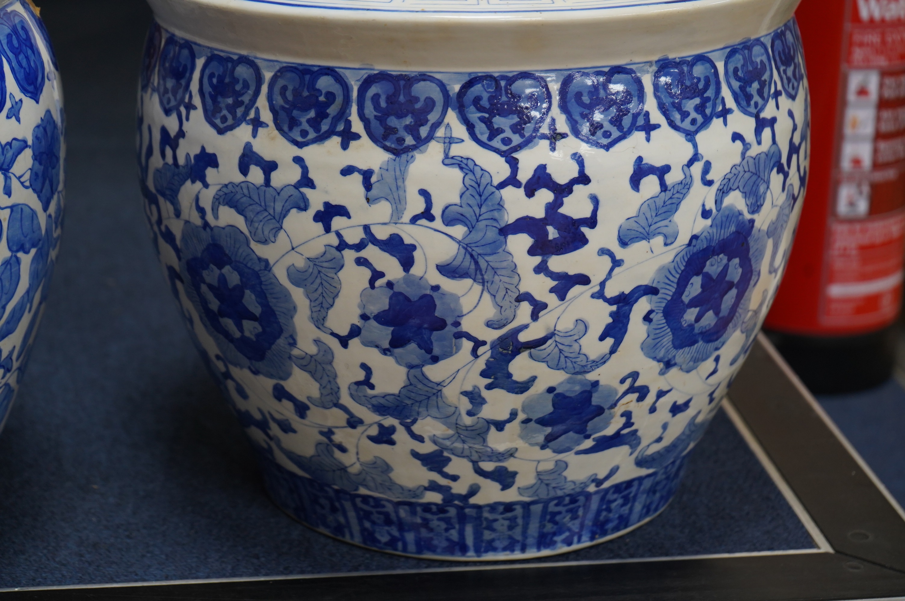 Two Chinese blue and white jardinieres, 31cm high. Condition - fair